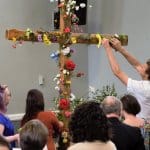 Placing flowers on the cross, Easter Sunday, April 1, 2018