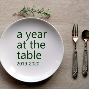 Place setting with A Year at the Table in text over the plate