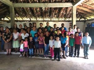 Group photo: RMC delegation with those attending morning celebration at San Romero Chapel in El Rodeo, El Salvador