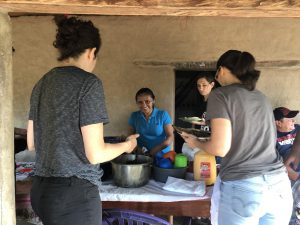 Breakfast table set up on the porch of the chapel/community center of Colón. Woman service is pictured with Angel, Melissa and Jackie.