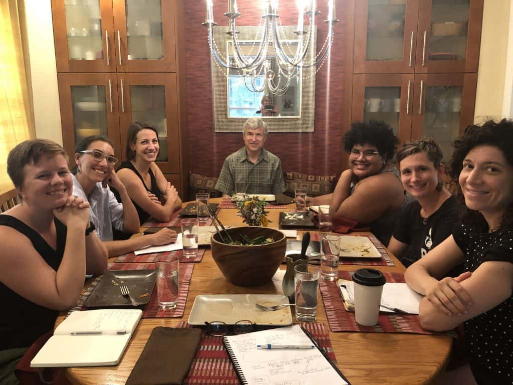 Delegation around dinner table planning El Salvador itinerary