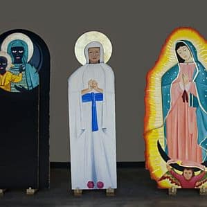 Three life-size depictions of Mary.