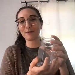Melissa holding up a jar during Zoom service March 28, 2021