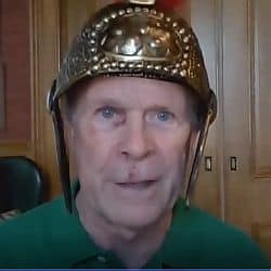 Hans in a gladiator helmet giving the homily on April 11, 2021