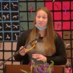 Raleigh Mennonite Church Cindy Locklear shares at RMC with crocheted prison awareness quilt in the background.