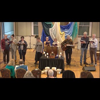 Nine member vocal ensemble singing at Raleigh Mennonite