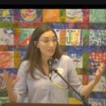 Melissa preaching in front of a quilt at our sanctuary on Oct 15 2023.