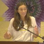 Raleigh Mennonite Church Melissa, holding her hands out while preaching on Dec. 3, 2023.