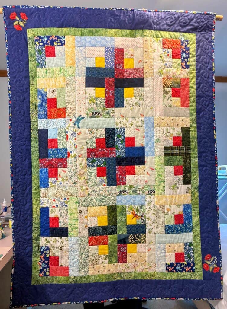Colorful quilted wall hanging given to Melissa on her last Sunday at RMC.