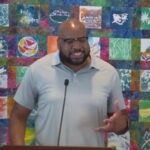 Trey preaching at RMC on Aug. 9, 2026, with one hand gesturing to make his point.