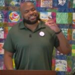Trey with his hand gesturing to make a point while preaching at RMC.